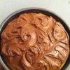 Vanilla Cake topped with swirly chocolate icing