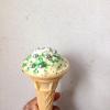 Homemade ice-cream topped with turquoise sugar and silver balls