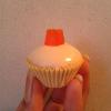 My confetti cake (confetti=rainbow sprinkles inside cake) covered in white chocolate and topped with an orange midget gem