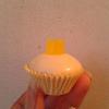 My confetti cake (confetti=rainbow sprinkles inside cake) covered in white chocolate and topped with a yellow midget gem