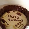 My Birthday Butterscotch cake covered in white chocolate, surrounded in kit kats and decorated with all things chocolate!