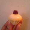 My confetti cake (confetti=rainbow sprinkles inside cake) covered in white chocolate and topped with a purple midget gem