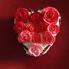 My Valentine's Day Red Velvet mini Heart cake filled with cream cheese frosting topped with white chocolate and hand-crafted fondant roses