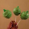 Apple style cake pops with peppermint interior, dipped in white chocolate(dyed green), with apple flavour log stalk, (green candy)