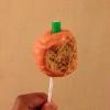 Orange style cake pops with orange interior, dipped in white chocolate(dyed red), and complete with an apple flavour log stalk(green candy)