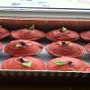 Apple cupcakes: Cake with apple chunks, topped with white chocolate (dyed red), a mikado piece ( to look like a stalk) and a green leaf (made out of molded candy).